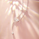 "Starlit Melody" Dangling Star Sterling Silver Drop Necklace