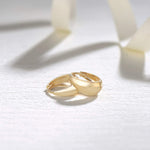 Small yellow gold hoops made in 14k yellow gold